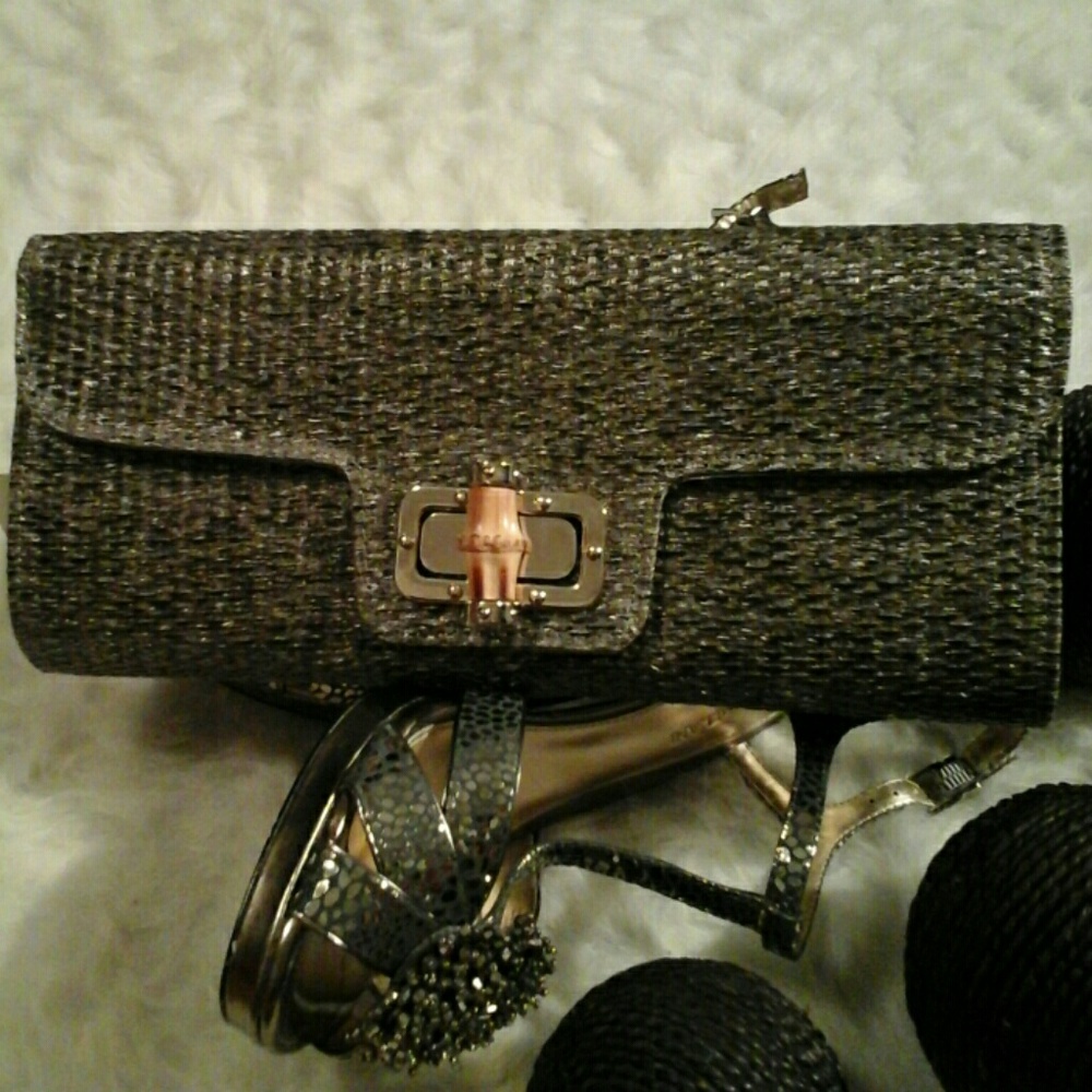 Bold Bag defined in a silvery, gray, clutch!